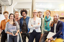 A group of happy and diverse employees dressed casually.